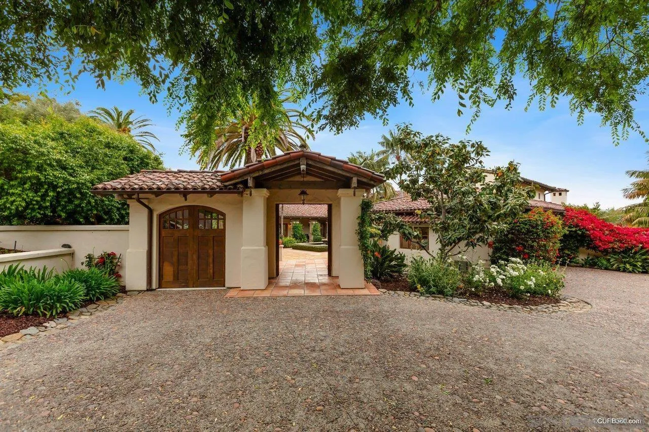5530 Codorniz Rancho Santa Fe, CA 92067 - Photo 5 of 37 a front view of a house with a yard and garage