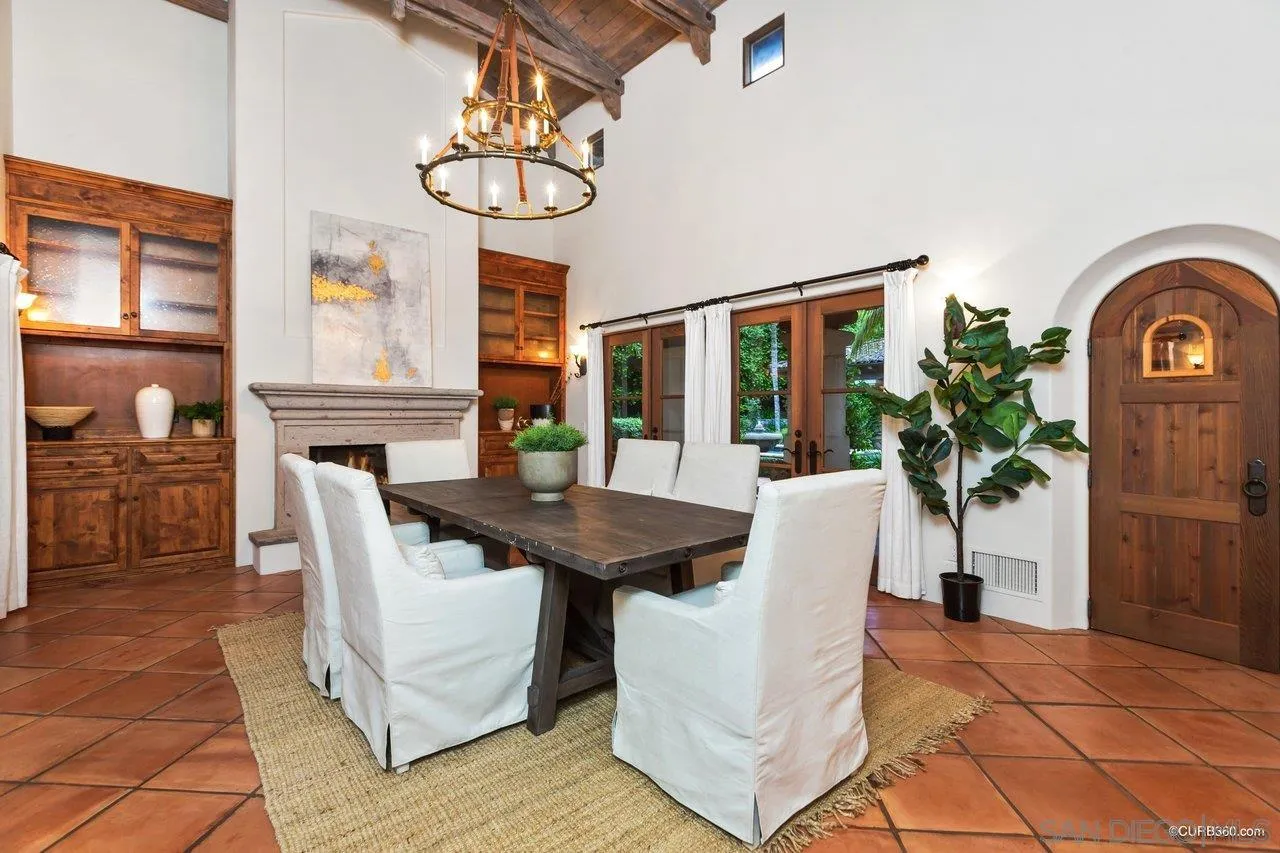 5530 Codorniz Rancho Santa Fe, CA 92067 - Photo 9 of 37 a view of a dining room with furniture window and wooden floor