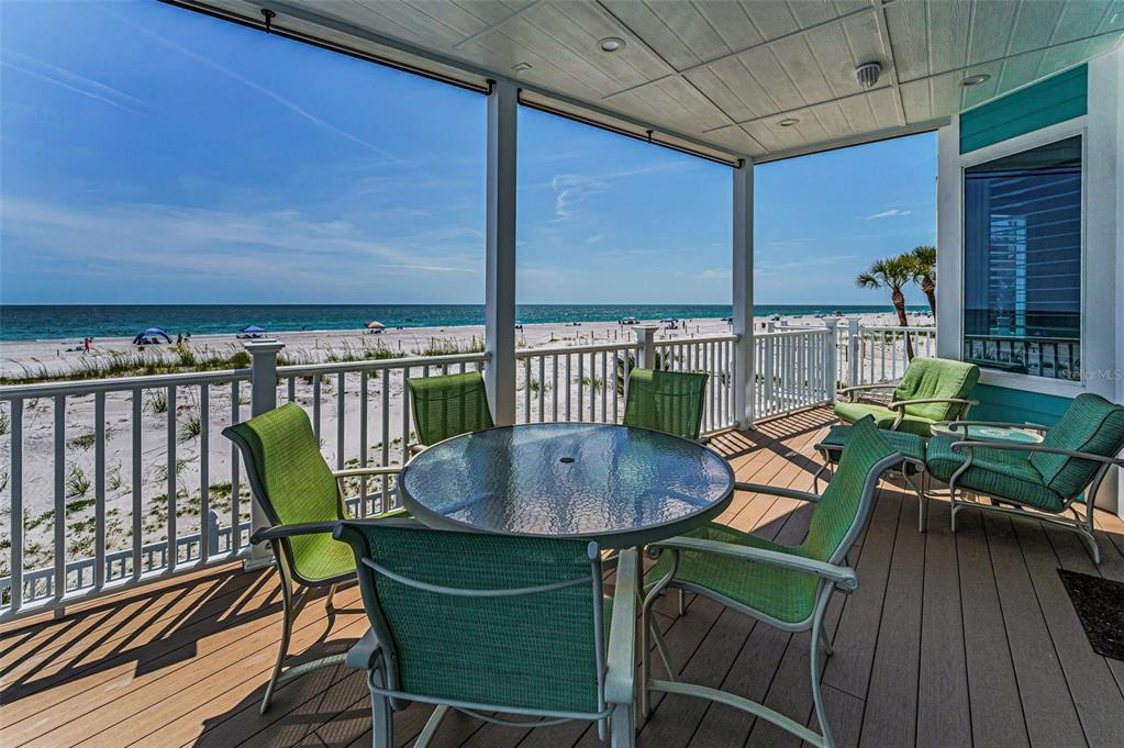 13303 Gulf Lane Madeira Beach, FL 33708 - Photo 11 of 42 a view of a chairs and table in the balcony