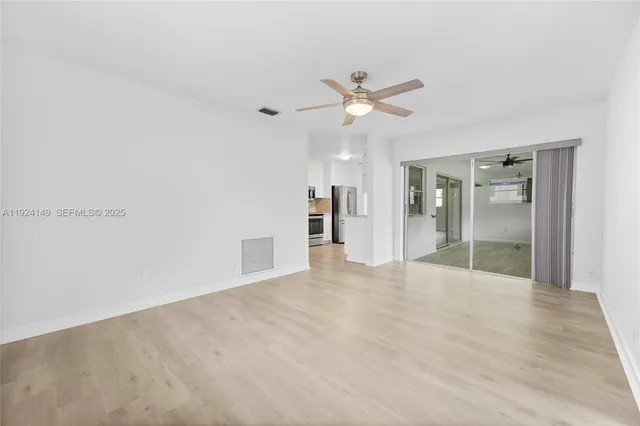 a view of an empty room with a bathroom