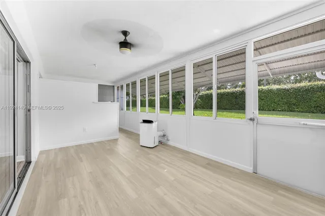 a view of an empty room with a window