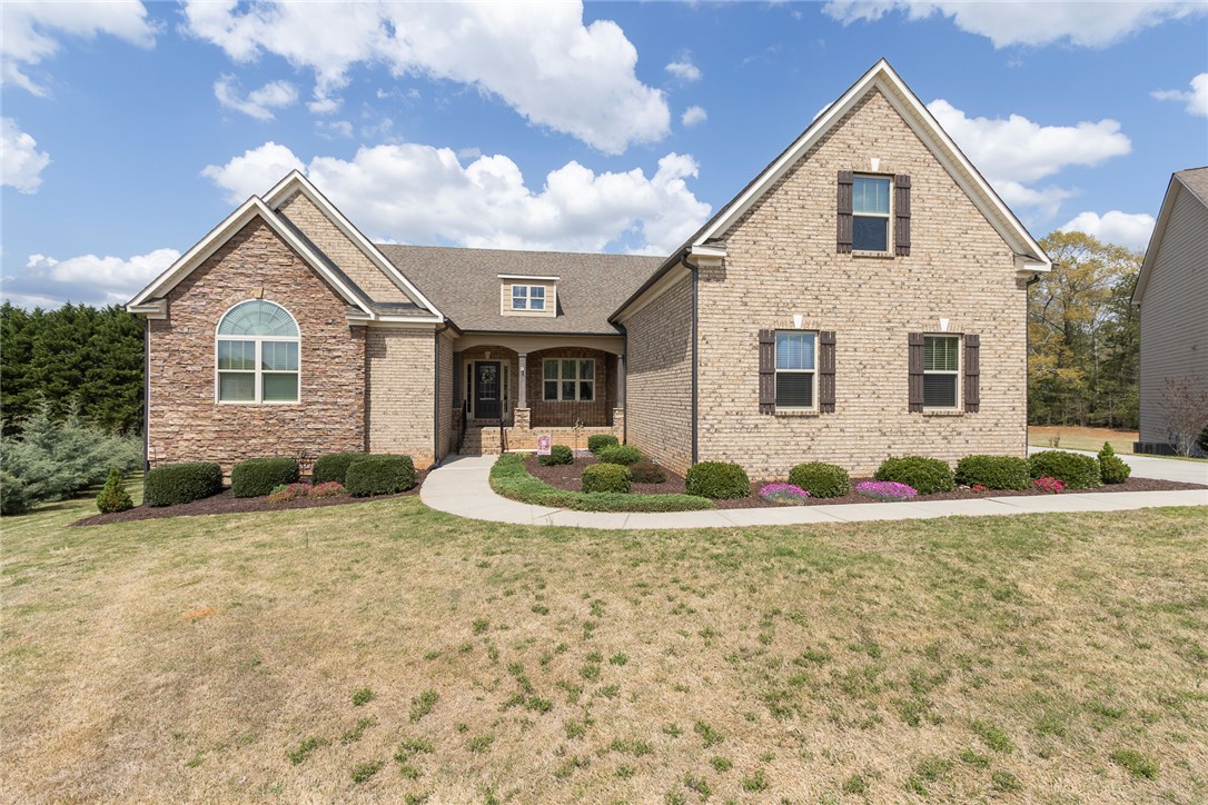 22 Old American Boulevard Pendleton, SC 29670 - Photo 1 of 49 This charming home features a brick and stone exterior with manicured landscaping.