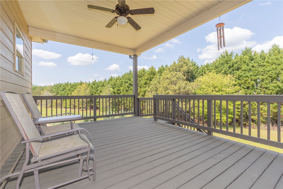 22 Old American Boulevard Pendleton, SC 29670 - Photo 12 of 49 Relax and enjoy outdoor living on this elevated deck, offering tranquil views of the surrounding trees.