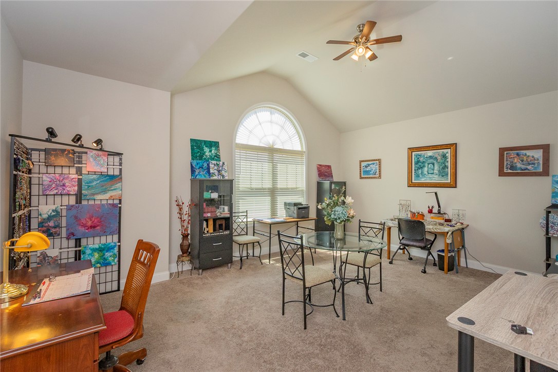 22 Old American Boulevard Pendleton, SC 29670 - Photo 19 of 49 This versatile room features vaulted ceilings, ample natural light, and plush carpeting.