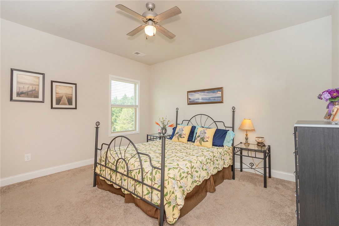 22 Old American Boulevard Pendleton, SC 29670 - Photo 22 of 49 This cozy bedroom features plush carpeting, a large window, and an inviting ambiance.