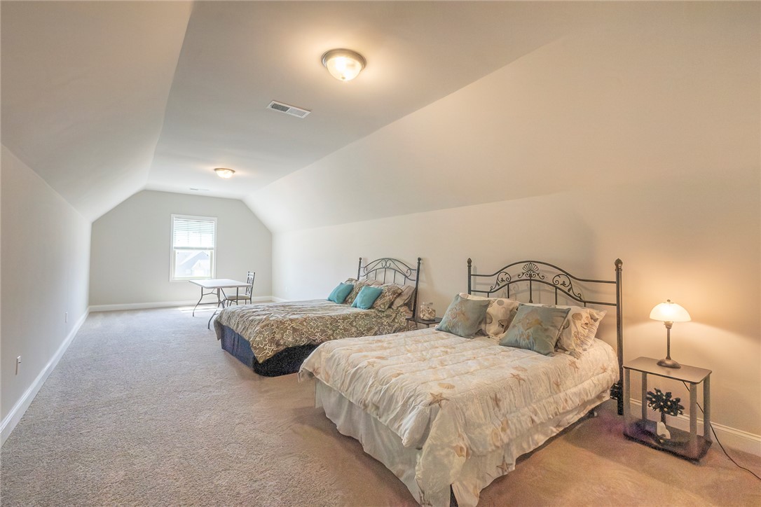 22 Old American Boulevard Pendleton, SC 29670 - Photo 27 of 49 Bright and airy bedroom with vaulted ceilings and ample natural light.