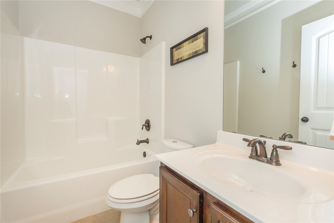22 Old American Boulevard Pendleton, SC 29670 - Photo 31 of 49 This bathroom features a sleek vanity and a tub shower combination for optimal comfort.