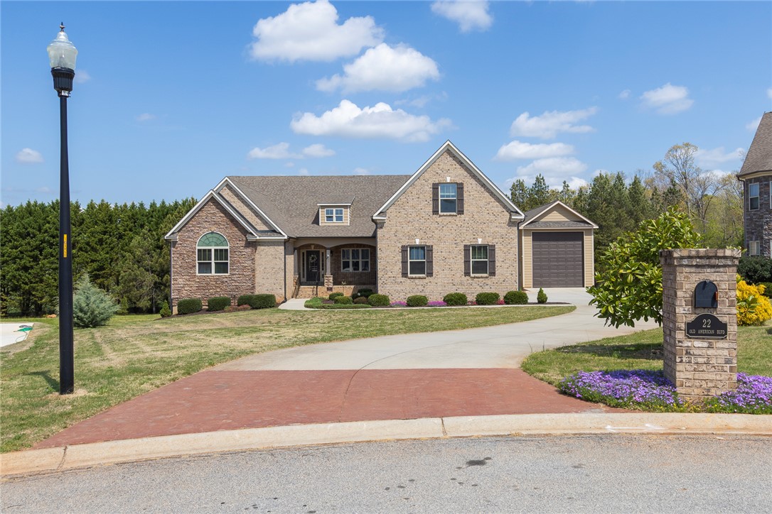22 Old American Boulevard Pendleton, SC 29670 - Photo 38 of 49 This charming residence features a well-manicured lawn and a spacious driveway.