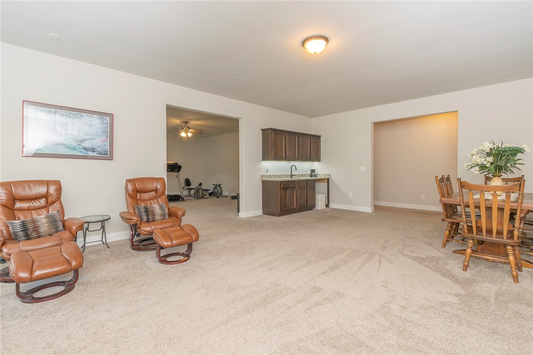 22 Old American Boulevard Pendleton, SC 29670 - Photo 39 of 49 This versatile recreation room features a built-in wet bar and abundant space for various activities.