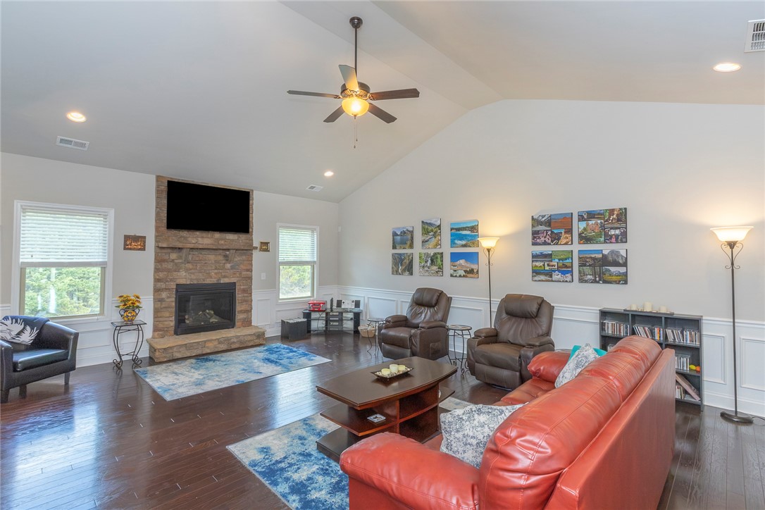 22 Old American Boulevard Pendleton, SC 29670 - Photo 4 of 49 This inviting living space features high ceilings and a cozy fireplace, perfect for relaxation.