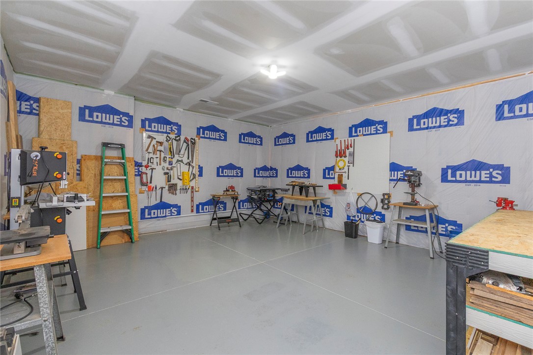 22 Old American Boulevard Pendleton, SC 29670 - Photo 41 of 49 This spacious garage offers ample room for projects and storage, featuring durable concrete flooring.