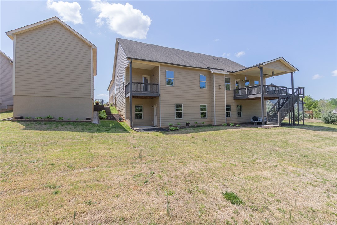 22 Old American Boulevard Pendleton, SC 29670 - Photo 43 of 49 This residence showcases a spacious backyard with a multi-level deck, perfect for outdoor enjoyment.