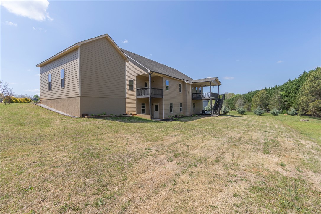 22 Old American Boulevard Pendleton, SC 29670 - Photo 44 of 49 This spacious residence features a multi-level design with expansive outdoor living areas and picturesque natural surroundings.