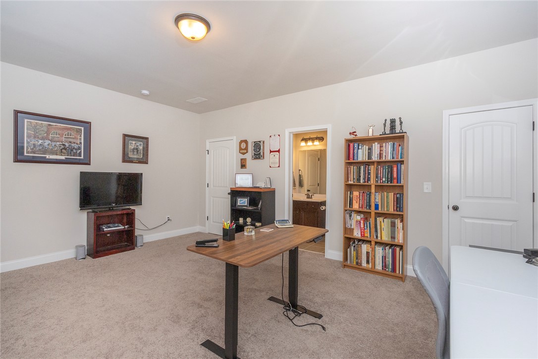 22 Old American Boulevard Pendleton, SC 29670 - Photo 48 of 49 This versatile room offers an ideal work-from-home setup, with easy access to a nearby bathroom.