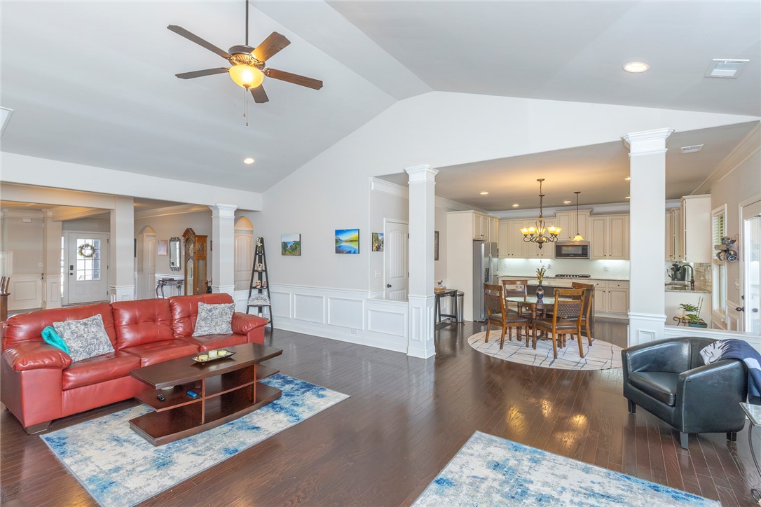 22 Old American Boulevard Pendleton, SC 29670 - Photo 5 of 49 This expansive open concept space features rich hardwood flooring and abundant natural light.