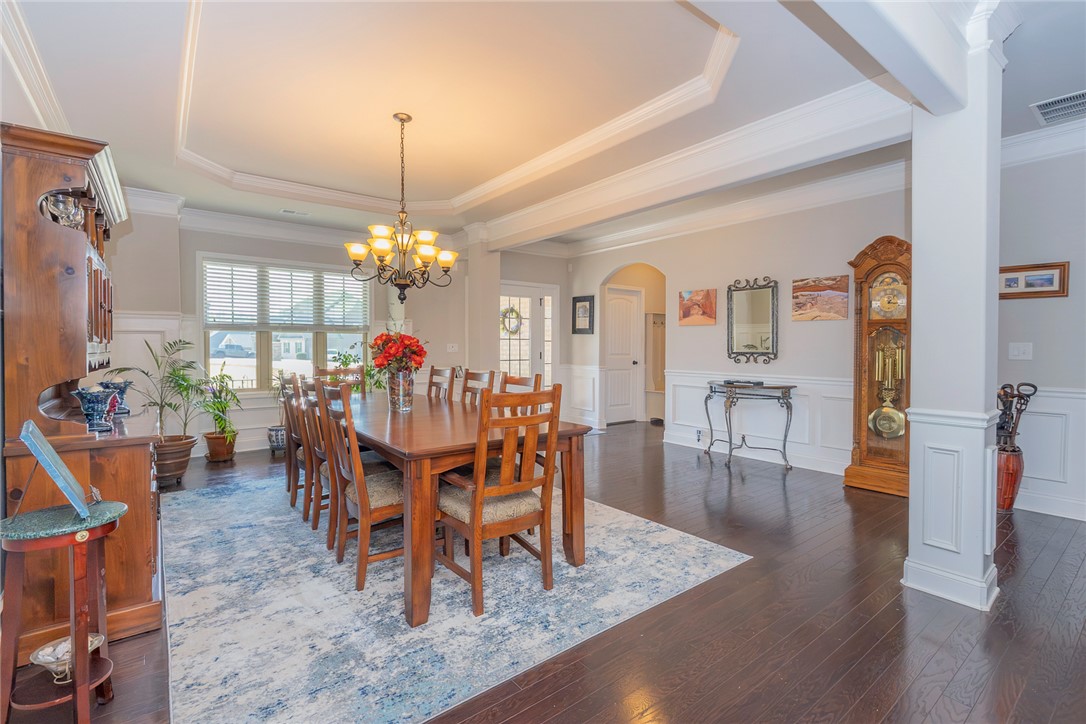 22 Old American Boulevard Pendleton, SC 29670 - Photo 7 of 49 Elegant dining room with beautiful hardwood floors and detailed ceiling features.
