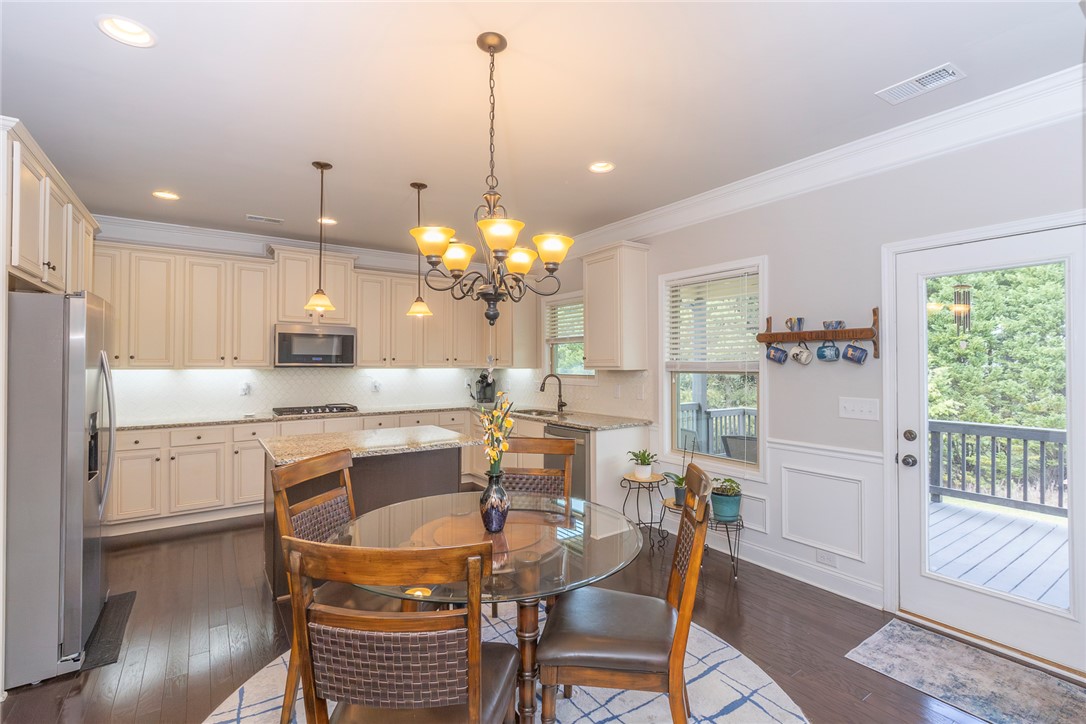 22 Old American Boulevard Pendleton, SC 29670 - Photo 8 of 49 This spacious kitchen offers a seamless flow for daily living and entertaining, featuring a large kitchen island.