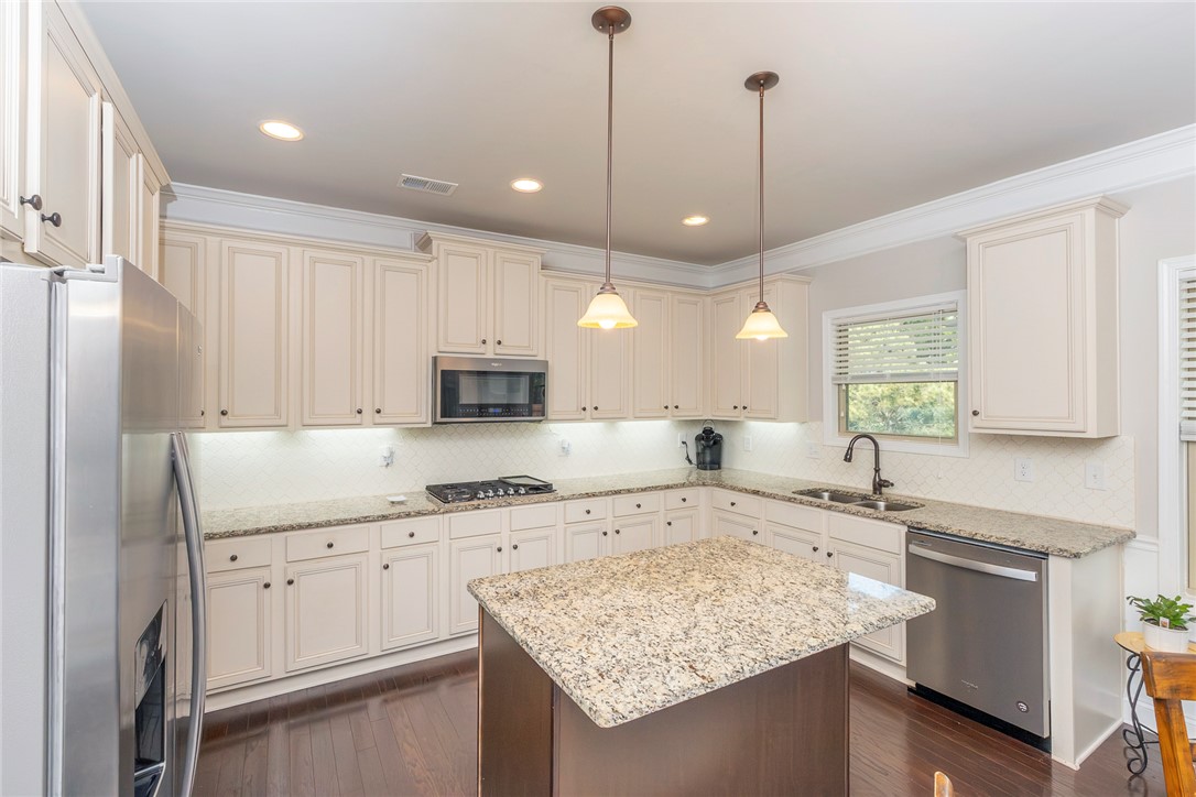 22 Old American Boulevard Pendleton, SC 29670 - Photo 9 of 49 This bright and airy kitchen boasts ample counter space and modern appliances for culinary delight.