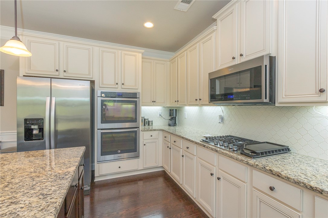 22 Old American Boulevard Pendleton, SC 29670 - Photo 10 of 49 This gourmet kitchen features top-tier appliances and rich hardwood floors, ideal for culinary adventures.