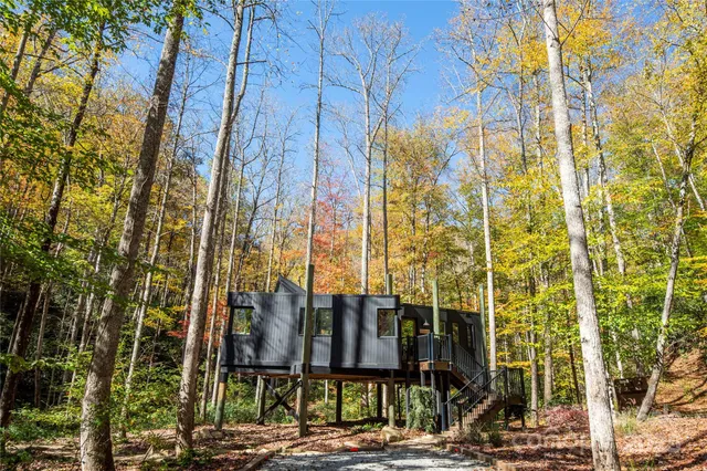 a view of a brick building next to a yard