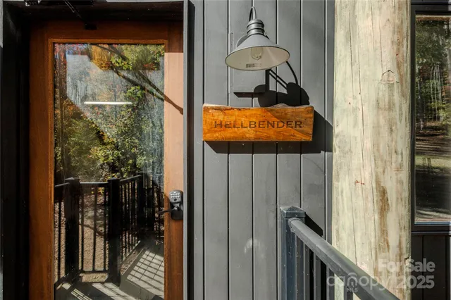 a backyard of a house with plants and large trees