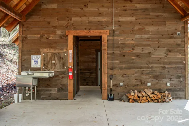 a view of staircase with railing and a chandelier