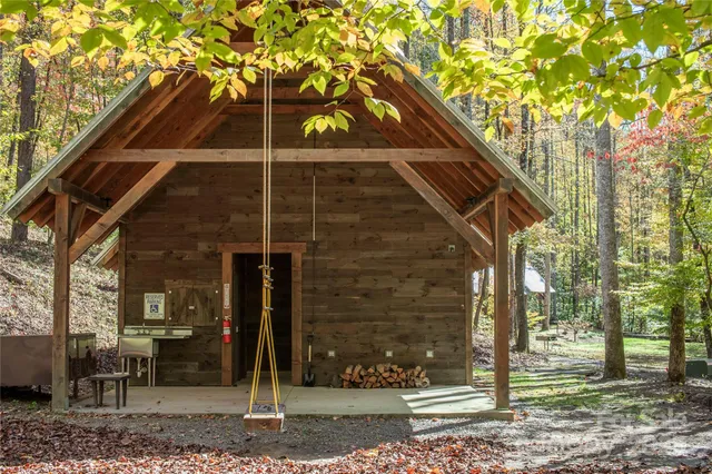 a view of a house with trees in the background