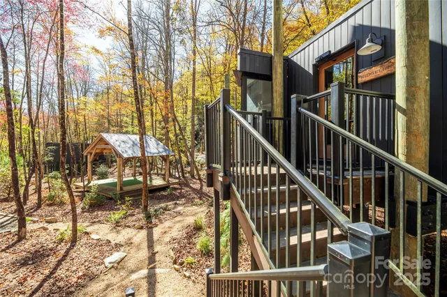 a bedroom with a bed couch and a window