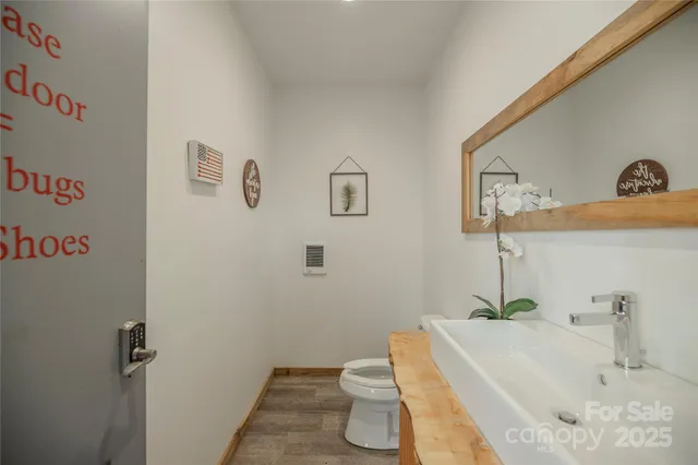 a roof deck with table and chairs