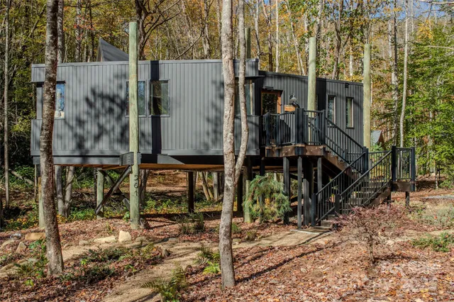 a bathroom with double vanity sink and two mirror