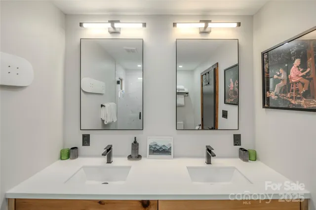 a bathroom with a toilet a sink and shower