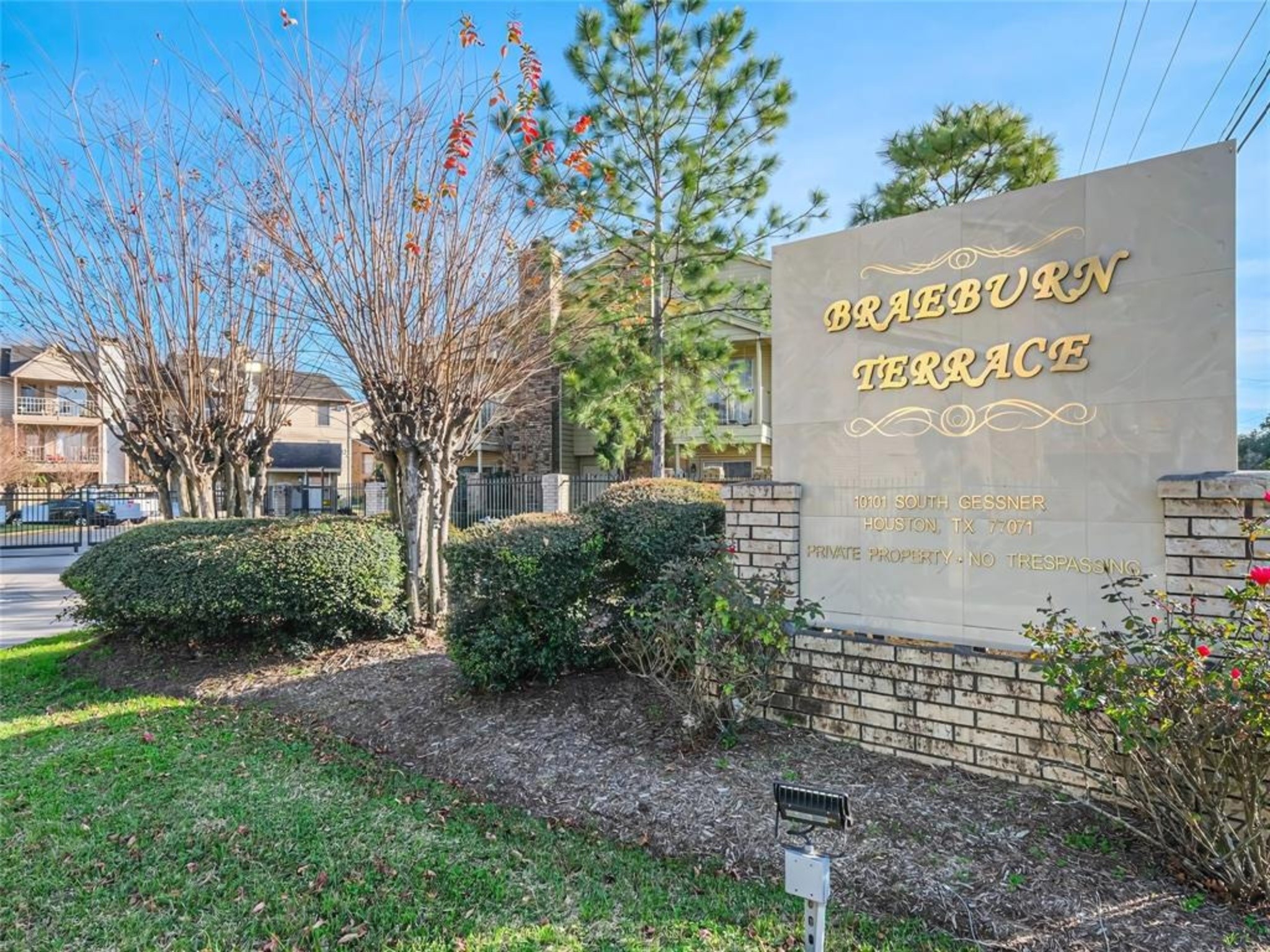 10101 South Gessner Road, Unit 515 Houston, TX 77071 - Photo 1 of 10 a signage on a brick wall