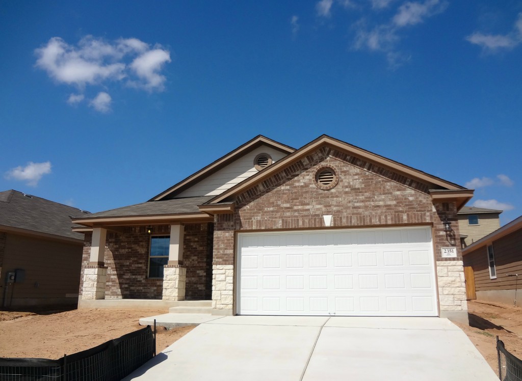 2351 Intrepid Drive Buda, TX 78610 - Photo 1 of 1 a front view of a house with yard