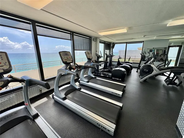 a view of a parking area with sitting space