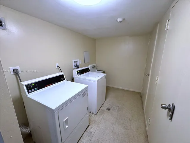 a view of hallway with washer and dryer