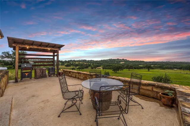 a view of chairs and table on the terrace