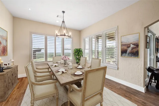 a view of a dining room with furniture window and outside view