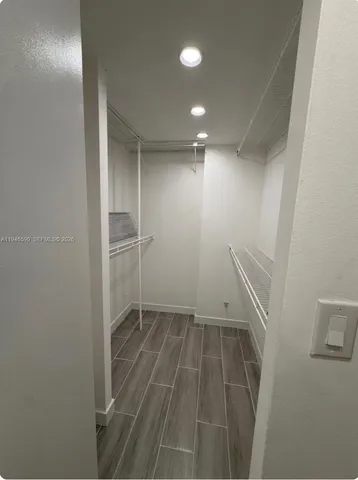 a bathroom with a mirror and a shower