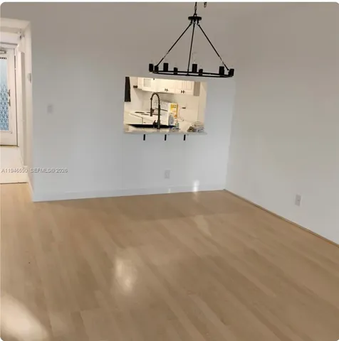 a view of a refrigerator in a kitchen