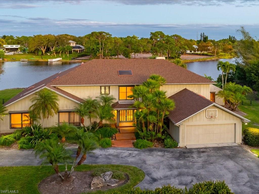154 Cajeput Drive Naples, FL 34108 - Photo 2 of 45 an aerial view of residential houses with outdoor space