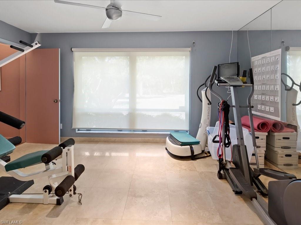 154 Cajeput Drive Naples, FL 34108 - Photo 40 of 45 a view of a room with gym equipment