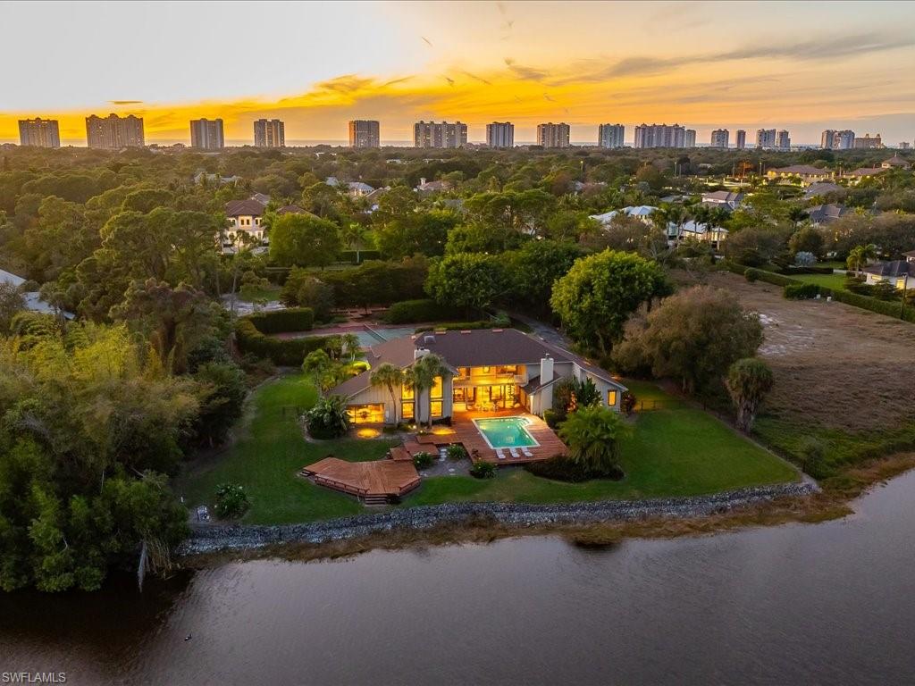 154 Cajeput Drive Naples, FL 34108 - Photo 4 of 45 an aerial view of a city