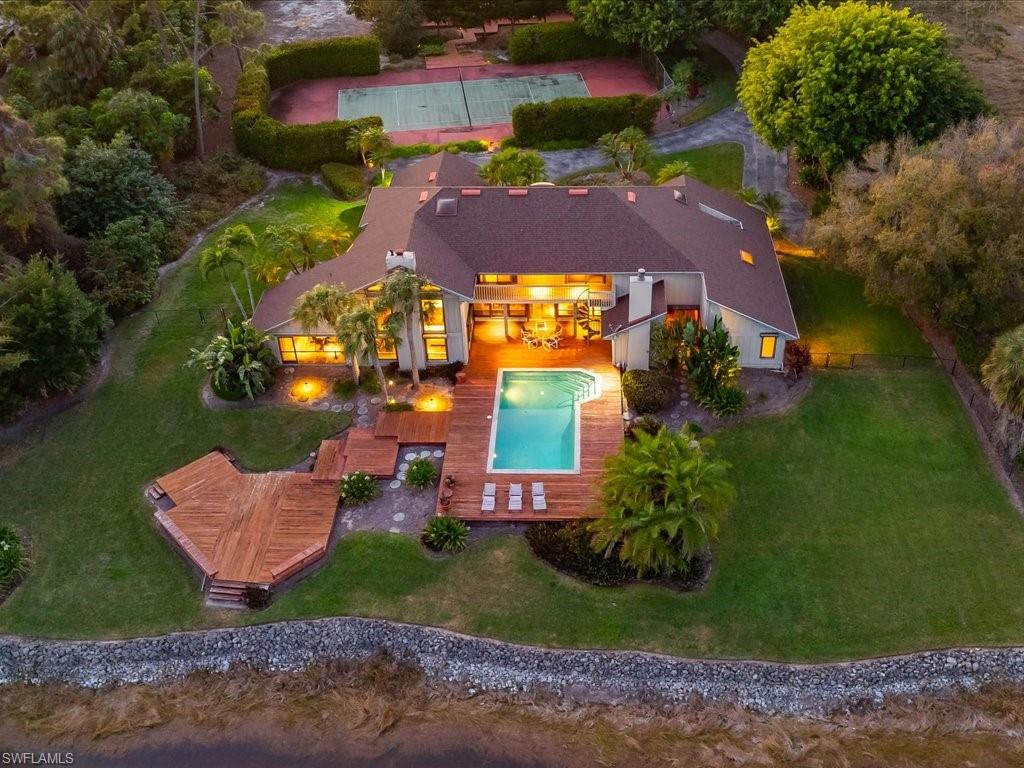 154 Cajeput Drive Naples, FL 34108 - Photo 5 of 45 an aerial view of a house