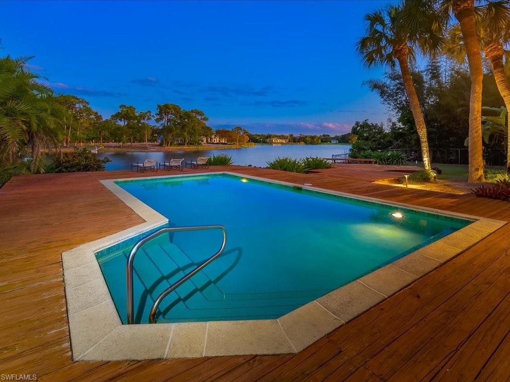 154 Cajeput Drive Naples, FL 34108 - Photo 10 of 45 a view of an outdoor space and swimming pool