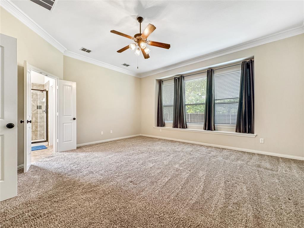 401 Varnum Way Fairview, TX 75069 - Photo 16 of 33 an empty room with chandelier fan and windows