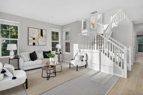 a living room with furniture and white walls