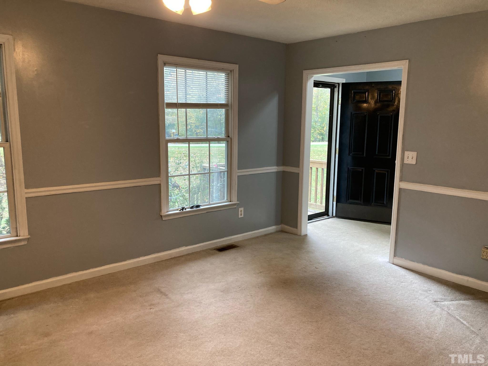 5924 Virgilina Road Roxboro, NC 27574 - Photo 1 of 6 a view of an empty room with a window
