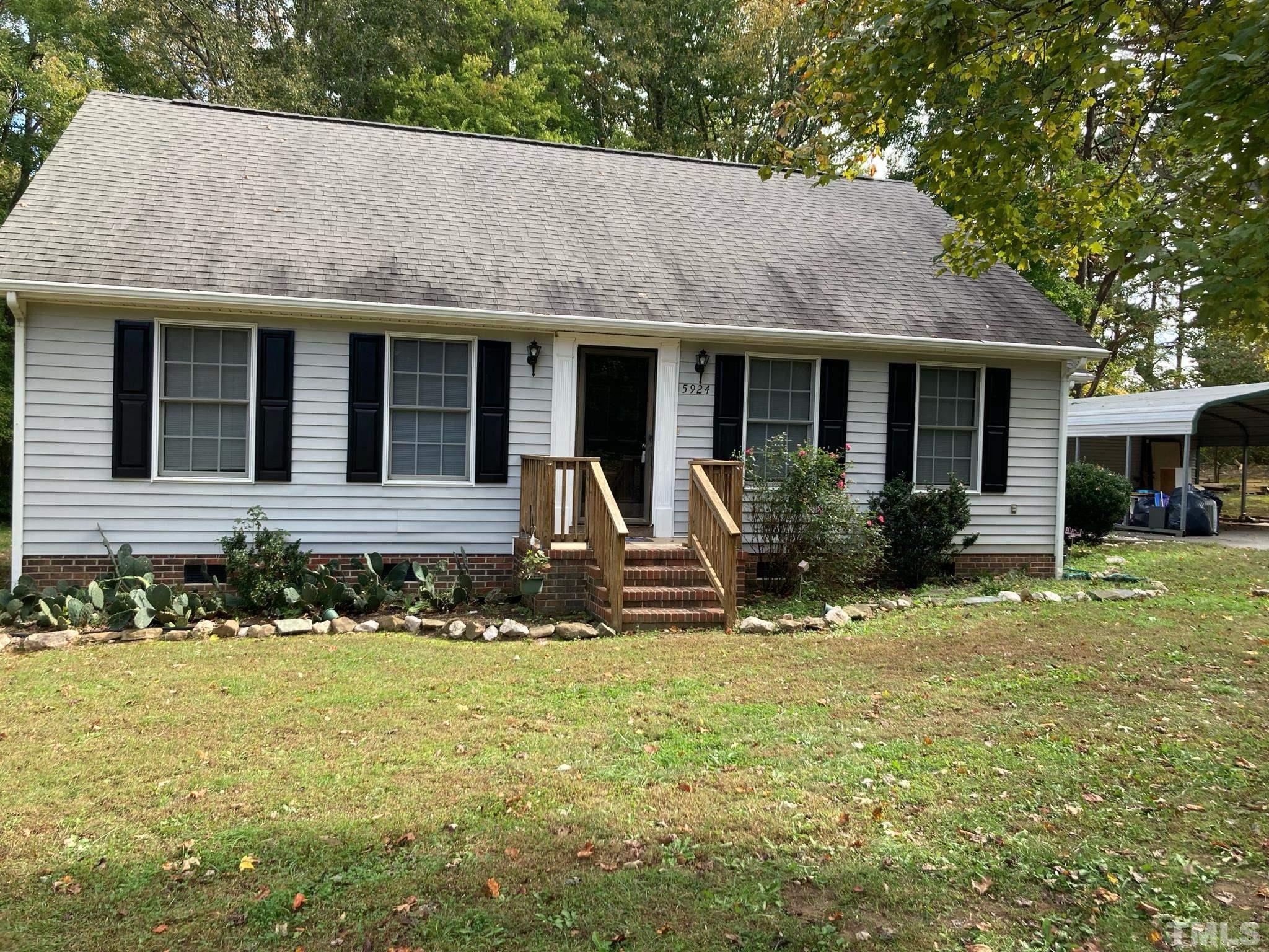 5924 Virgilina Road Roxboro, NC 27574 - Photo 6 of 6 a front view of a house with yard
