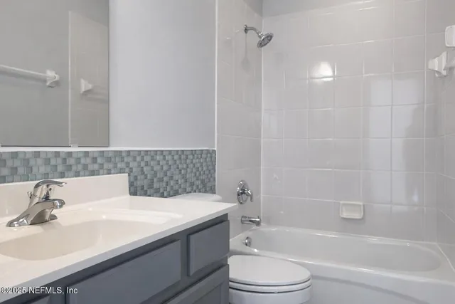 a bathroom with a sink a toilet and a bathtub