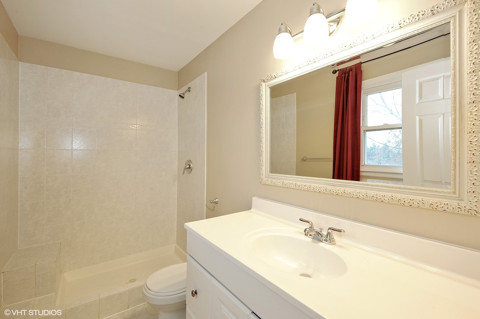 147 Spring Avenue Glen Ellyn, IL 60137 - Photo 8 of 14 a bathroom with a sink a toilet and shower